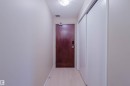 Hall featuring a textured ceiling and light wood finished floors - 207 9910 111 Street, Edmonton, AB  - Indoor Photo Showing Other Room 