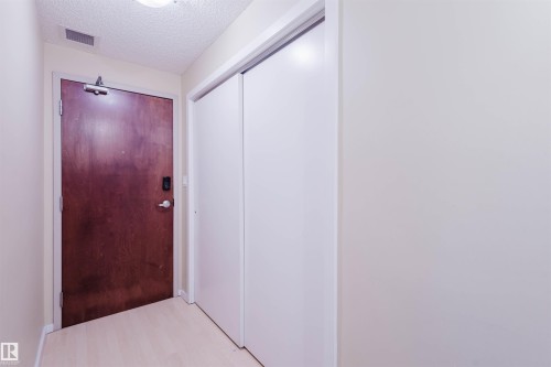 Corridor with a textured ceiling - 207 9910 111 Street, Edmonton, AB - Indoor Photo Showing Other Room