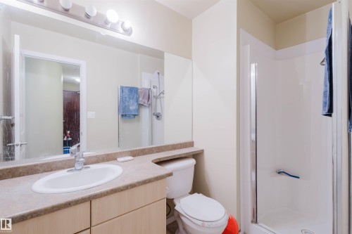 Full bath with a shower stall and vanity - 207 9910 111 Street, Edmonton, AB - Indoor Photo Showing Bathroom