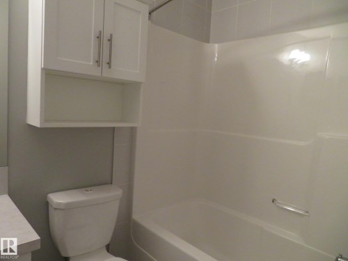 Bathroom featuring shower / tub combination and vanity - 415 2590 Anderson Way, Edmonton, AB - Indoor Photo Showing Bathroom