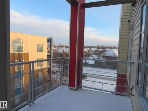 View of snow covered back of property - 415 2590 Anderson Way, Edmonton, AB - Outdoor With Exterior