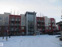 Snow covered building with a view of apartment building / complex - 415 2590 Anderson Way, Edmonton, AB  - Outdoor With Facade 