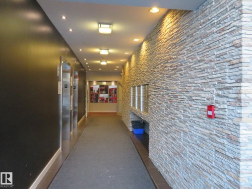 Hallway featuring recessed lighting and elevator - 415 2590 Anderson Way, Edmonton, AB - Indoor Photo Showing Other Room
