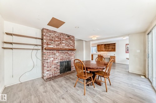 7809 116 Street, Edmonton, AB - Indoor Photo Showing Dining Room With Fireplace