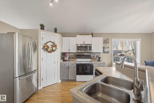 3203 49 Street, Beaumont, AB - Indoor Photo Showing Kitchen With Double Sink