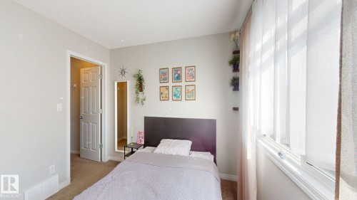 Bedroom featuring light colored carpet and baseboards - 1275 Chappelle Boulevard, Edmonton, AB - Indoor Photo Showing Bedroom