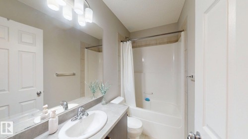Bathroom with vanity and shower / tub combo - 1275 Chappelle Boulevard, Edmonton, AB - Indoor Photo Showing Bathroom