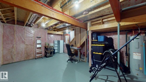Unfinished below grade area with electric water heater - 1275 Chappelle Boulevard, Edmonton, AB - Indoor Photo Showing Basement