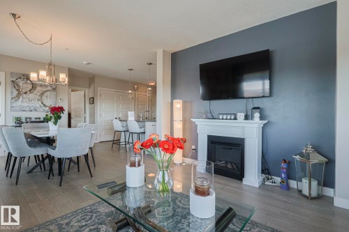 910 2755 109 Street, Edmonton, AB - Indoor Photo Showing Dining Room With Fireplace