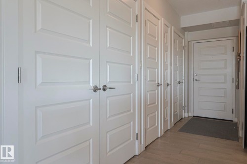 Hallway with light wood-type flooring - 910 2755 109 Street, Edmonton, AB - Indoor Photo Showing Other Room