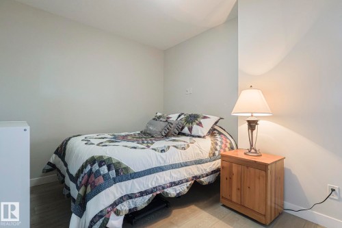 Bedroom featuring baseboards and light wood-type flooring - 910 2755 109 Street, Edmonton, AB - Indoor Photo Showing Bedroom