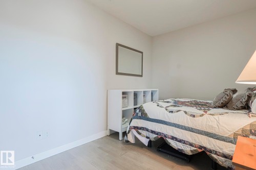Bedroom featuring light wood finished floors and baseboards - 910 2755 109 Street, Edmonton, AB - Indoor Photo Showing Bedroom