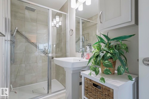 Bathroom featuring a shower stall and a sink - 910 2755 109 Street, Edmonton, AB - Indoor Photo Showing Bathroom