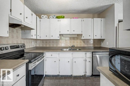 82 Erie Street S, Devon, AB - Indoor Photo Showing Kitchen With Double Sink