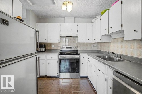 82 Erie Street S, Devon, AB - Indoor Photo Showing Kitchen With Double Sink