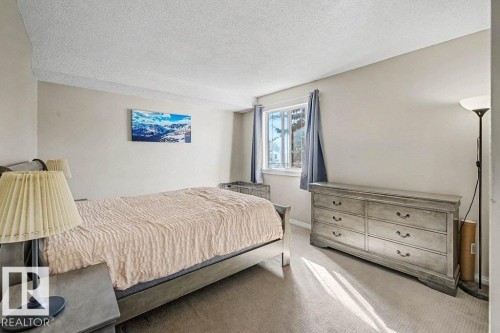 82 Erie Street S, Devon, AB - Indoor Photo Showing Bedroom