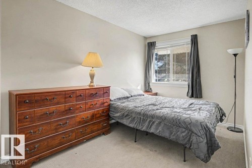 82 Erie Street S, Devon, AB - Indoor Photo Showing Bedroom