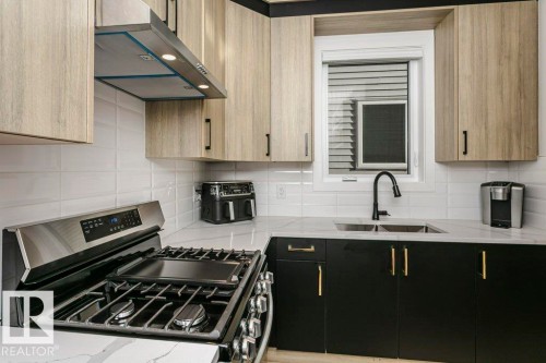 839 34 Av, Edmonton, AB - Indoor Photo Showing Kitchen With Double Sink With Upgraded Kitchen