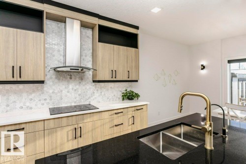 839 34 Av, Edmonton, AB - Indoor Photo Showing Kitchen With Double Sink