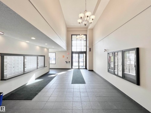 Community lobby featuring a high ceiling and recessed lighting - 3308 9351 Simpson Drive, Edmonton, AB - Indoor Photo Showing Other Room
