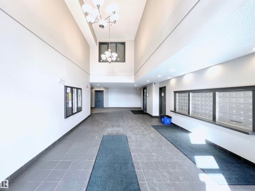 Building lobby featuring a high ceiling and recessed lighting - 3308 9351 Simpson Drive, Edmonton, AB - Indoor Photo Showing Other Room
