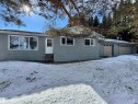 View of front facade with stucco siding, entry steps, and a garage - 4801 52 Avenue, Andrew, AB  - Outdoor 