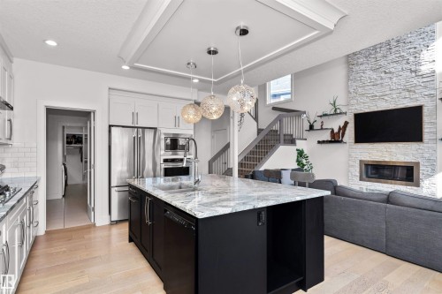 2009 Blue Jay Crest, Edmonton, AB - Indoor Photo Showing Kitchen With Fireplace With Upgraded Kitchen
