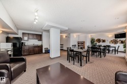 Living room featuring light carpet and a textured ceiling - 