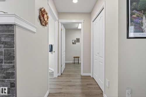 Corridor with baseboards and light wood-type flooring - 30 4 Heritage Way, St. Albert, AB - Indoor Photo Showing Other Room