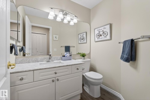 Bathroom with vanity and dark wood-style floors - 30 4 Heritage Way, St. Albert, AB - Indoor Photo Showing Bathroom