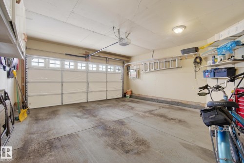 Garage with a garage door opener - 30 4 Heritage Way, St. Albert, AB - Indoor Photo Showing Garage
