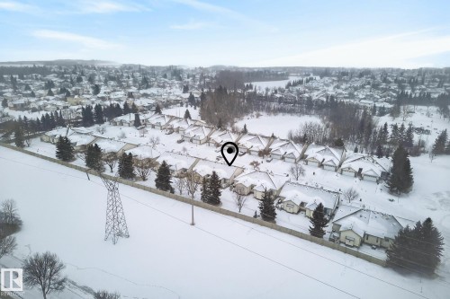 Snowy aerial view with a residential view - 30 4 Heritage Way, St. Albert, AB - Outdoor With View