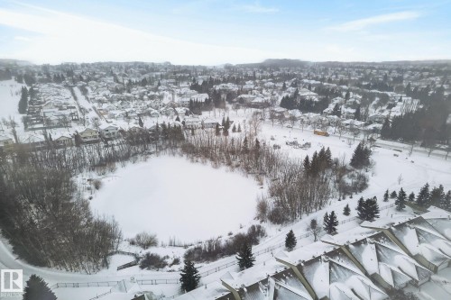 Snowy aerial view featuring a residential view - 30 4 Heritage Way, St. Albert, AB - Outdoor With View