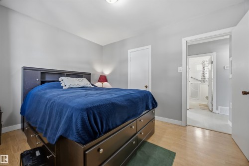 Bedroom featuring light laminate floors and baseboards - 4209 116 Avenue, Edmonton, AB - Indoor Photo Showing Bedroom