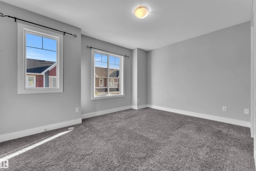 Unfurnished room with carpet and baseboards - #38 1508 105 St Nw, Edmonton, AB - Indoor Photo Showing Other Room