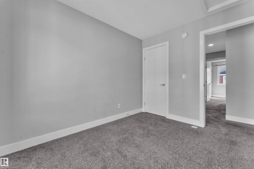 Unfurnished bedroom featuring carpet floors and recessed lighting - #38 1508 105 St Nw, Edmonton, AB - Indoor Photo Showing Other Room