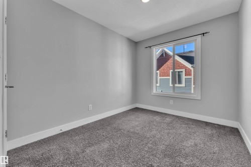 Carpeted empty room featuring baseboards - #38 1508 105 St Nw, Edmonton, AB - Indoor Photo Showing Other Room