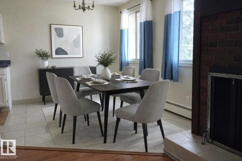 202 10826 113 Street Nw, Edmonton, AB - Indoor Photo Showing Dining Room With Fireplace