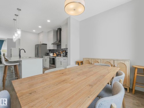 Dining space featuring recessed lighting and light wood finished floors - 1404 Podersky Link, Edmonton, AB - Indoor Photo Showing Kitchen With Upgraded Kitchen
