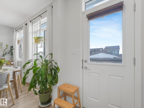 Doorway featuring wood finished floors - 1404 Podersky Link, Edmonton, AB - Indoor Photo Showing Other Room