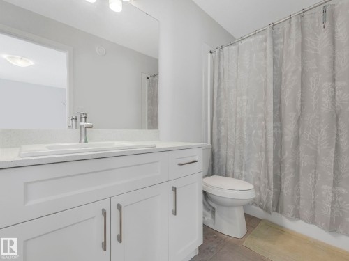 Bathroom featuring vanity and toilet - 1404 Podersky Link, Edmonton, AB - Indoor Photo Showing Bathroom