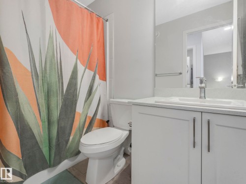 Bathroom featuring vanity and curtained shower - 1404 Podersky Link, Edmonton, AB - Indoor Photo Showing Bathroom
