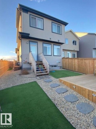 Back of property featuring a fenced backyard, captured during summer - 1404 Podersky Link, Edmonton, AB - Outdoor