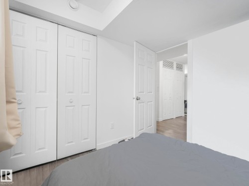 Unfurnished bedroom featuring a closet and light wood-style flooring - 1404 Podersky Link, Edmonton, AB - Indoor Photo Showing Other Room