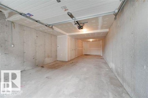 View of garage - 1621 Cunningham Way Sw, Edmonton, AB - Indoor Photo Showing Garage