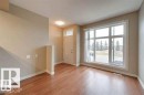 Entryway featuring baseboards and light wood finished floors - 1621 Cunningham Way Sw, Edmonton, AB  - Indoor Photo Showing Other Room 