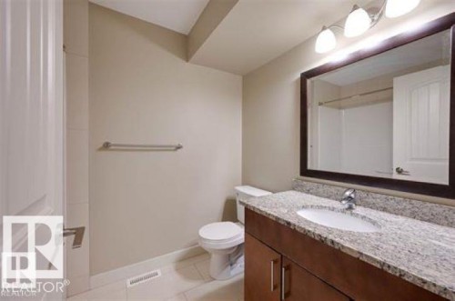 Bathroom with vanity and light tile patterned floors - 1621 Cunningham Way Sw, Edmonton, AB - Indoor Photo Showing Bathroom