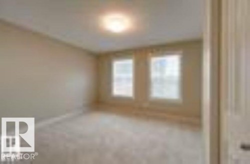 View of unfurnished room - 1621 Cunningham Way Sw, Edmonton, AB - Indoor Photo Showing Other Room
