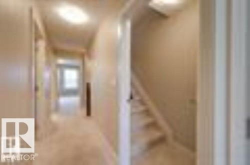 Hall featuring stairs - 1621 Cunningham Way Sw, Edmonton, AB - Indoor Photo Showing Other Room
