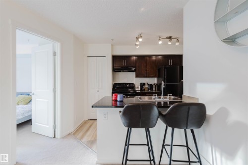 313 5816 Mullen Place, Edmonton, AB - Indoor Photo Showing Kitchen With Double Sink